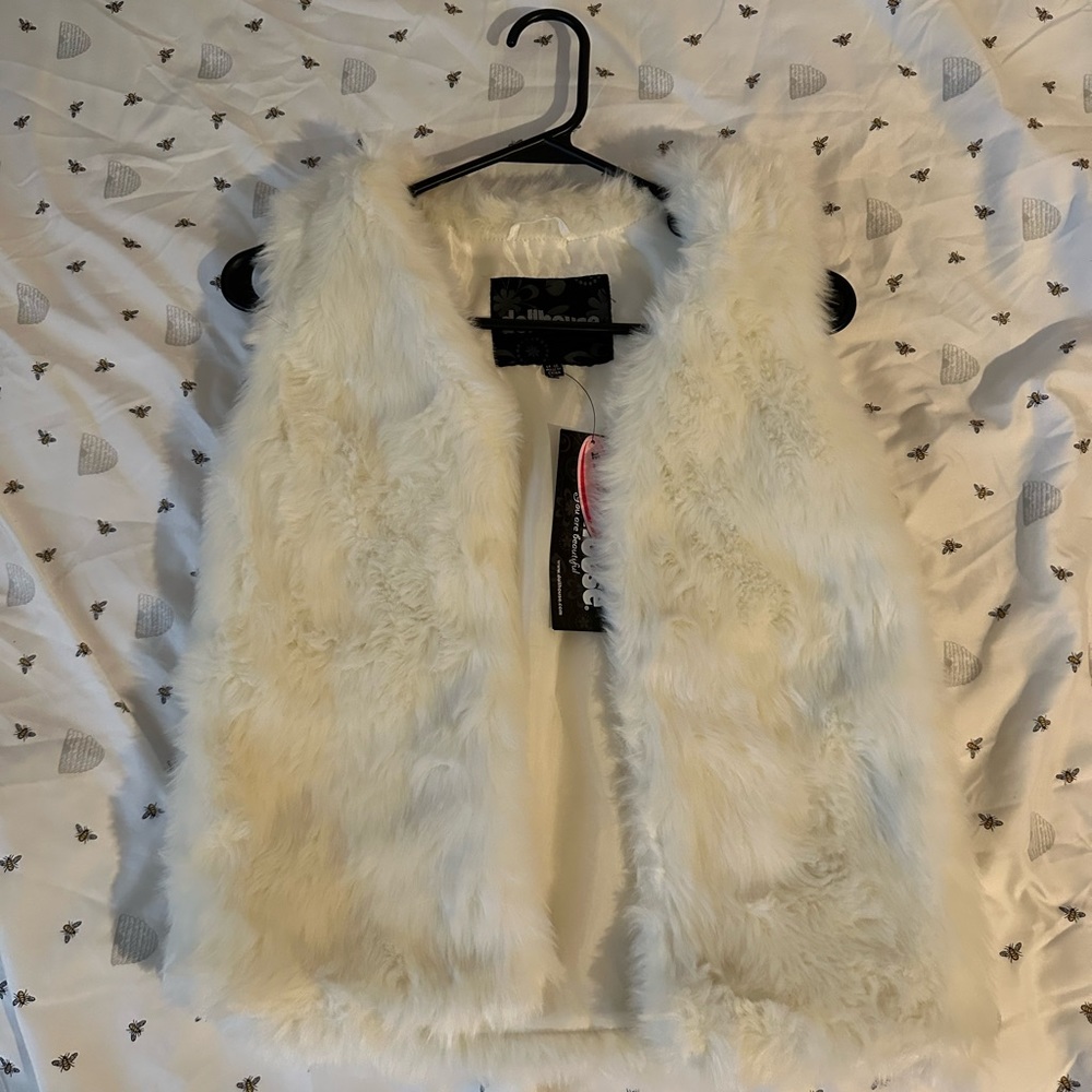 White fur vest